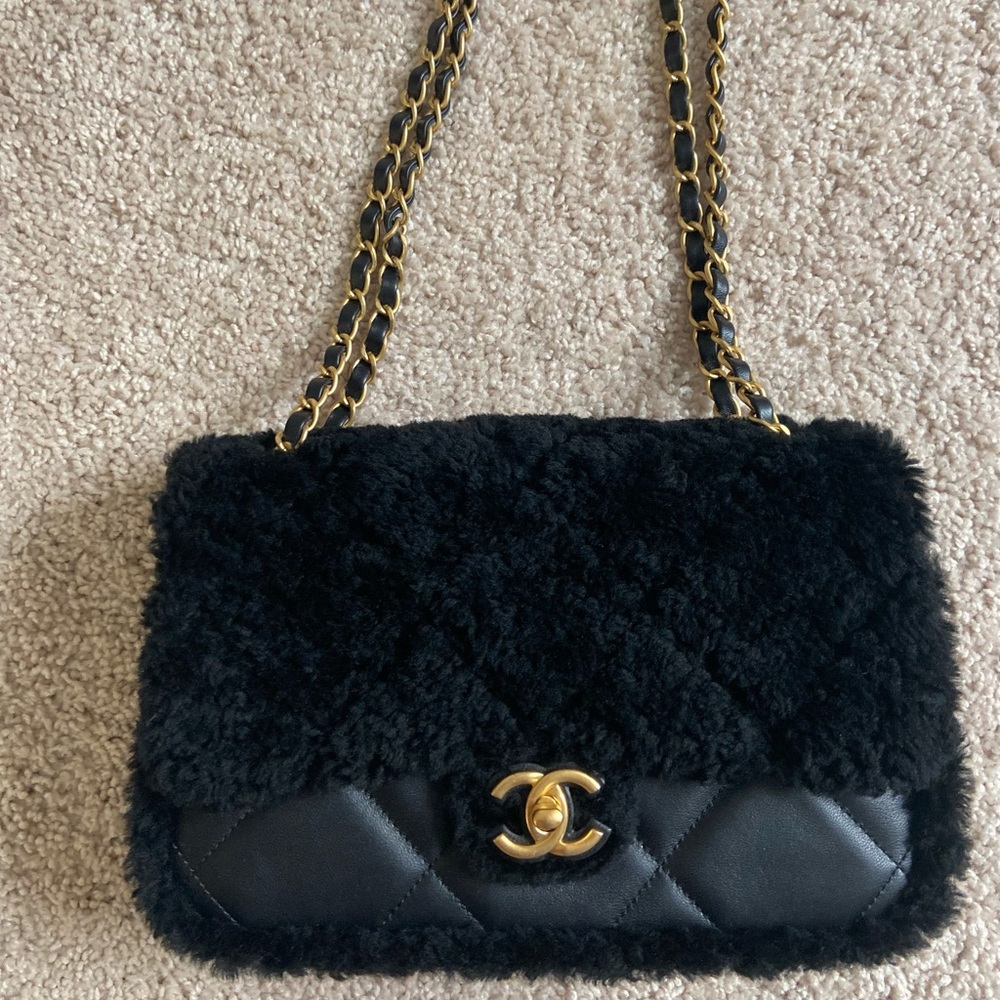 Chanel black shearling flap bag. Black